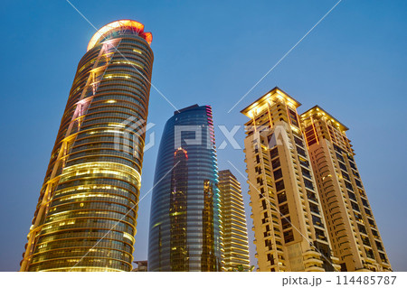 Modern skyscrapers illuminated at twilight 114485787