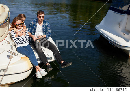 family with daughter Fishing on yacht sailboat on lake family with daughter Fishing on yacht sailboat on lake 114486715