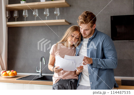 surprised unhappy couple has informed about debt surprised unhappy couple has informed about debt 114487535