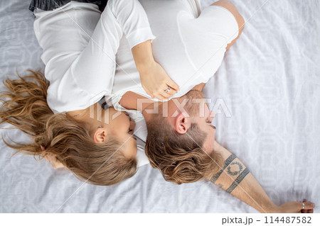 Young loving sleeping together. close up top view photo 114487582