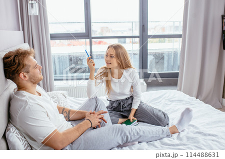 young awesome girl giving advise to her handsome boy at home young awesome girl giving advise to her handsome boy at home 114488631