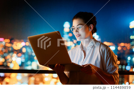 businesswoman working on laptop businesswoman working on laptop 114489859