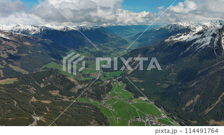 Village in valley and mountain in Alps 114491764