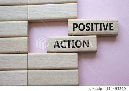 Positive action symbol. Concept words Positive action on wooden blocks. Beautiful pink background. Business and Positive action concept. Copy space. Positive action symbol. Concept words Positive action on wooden blocks. Beautiful pink background. Business and Positive action concept. Copy space. 114495260
