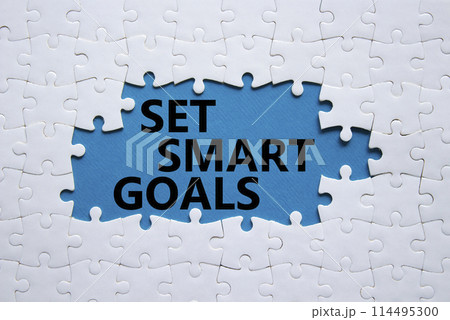 Set smart goals symbol. Concept words Set smart goals on white puzzle. Beautiful blue background. Business and Set smart goals concept. Copy space. Set smart goals symbol. Concept words Set smart goals on white puzzle. Beautiful blue background. Business and Set smart goals concept. Copy space. 114495300