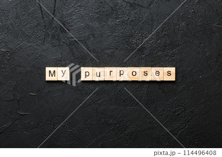my purposes word written on wood block. my purposes text on cement table for your desing, concept 114496408