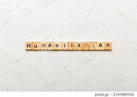 humanitarian word written on wood block. humanitarian text on table, concept 114496438