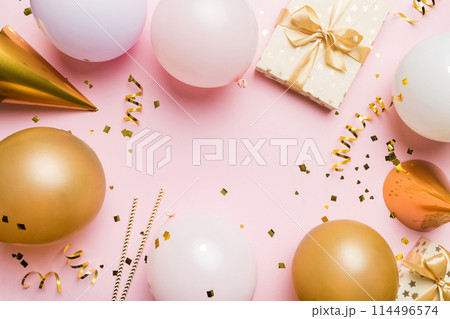 Flat lay party decoration concept on pastel colored background from above. Love concept. Holiday celebration. Valentine Day or birthday party decoration 114496574