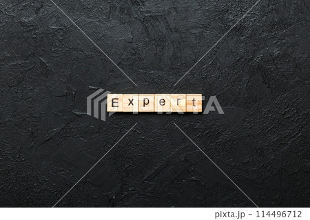 expert word written on wood block. expert text on table, concept expert word written on wood block. expert text on table, concept 114496712