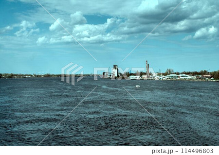 oil refinery river in evening 114496803