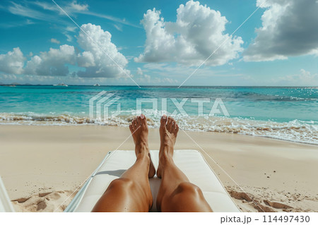 Relaxing beach day: sunbathing on tropical sands 114497430