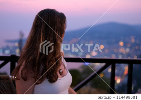 Young girl traveling in Albania attractions beauty nature. Gjirokastra attractions of Albania. Traveling to Albania watching the sights surprised young woman delighted with what is happening around 114498681