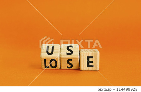 You use or lose it symbol. Concept word Use or lose on wooden cubes. Beautiful orange table orange background. Business and you use or lose it concept. Copy space. You use or lose it symbol. Concept word Use or lose on wooden cubes. Beautiful orange table orange background. Business and you use or lose it concept. Copy space. 114499928