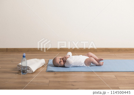 Home exercise for mother and baby, mommy and me workout. Physical activity for mother while bonding with children. Home exercise for mother and baby, mommy and me workout. Physical activity for mother while bonding with children. 114500445