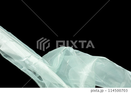 Off White Organza fabric flying in curve shape, Piece of textile White Organza fabric throw fall in air. Black background isolated motion blur Off White Organza fabric flying in curve shape, Piece of textile White Organza fabric throw fall in air. Black background isolated motion blur 114500703