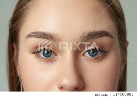 Close Up of Womans Face With Blue Eyes 114500905