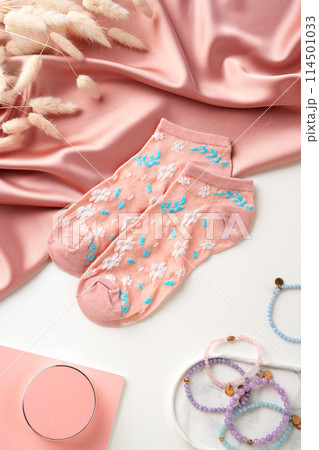 Pink socks with pattern on white background 114501033