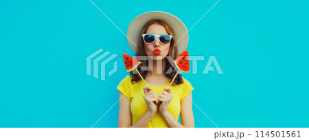 Summer portrait of stylish young woman with juicy lollipop or ice cream shaped slice of watermelon 114501561