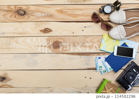 Accessories for travel. Passport, photo camera and travel map. Top view. Holidays and tourism concept 114502296