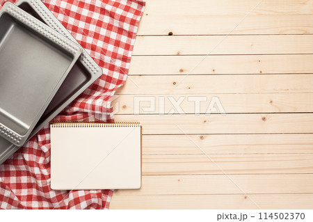 Various kitchen utensils on wooden table 114502370