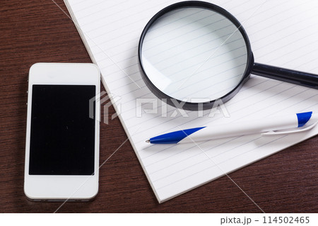 Notebook and magnifier Notebook and magnifier 114502465
