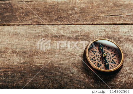 Compass on a wood deck Compass on a wood deck 114502562