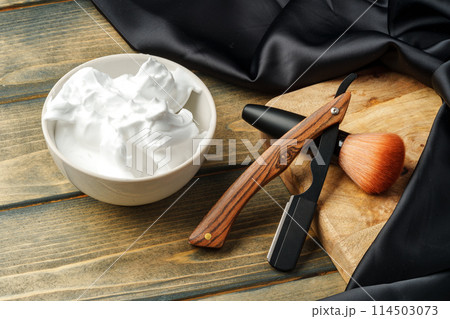 Set of professional barber tools on wooden table 114503073