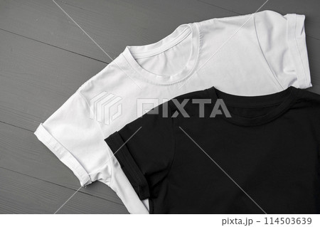 Cotton T-shirt mock up on wooden background flat lay Cotton T-shirt mock up on wooden background flat lay 114503639