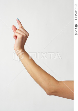Hand picking something against white background copy space Hand picking something against white background copy space 114503808