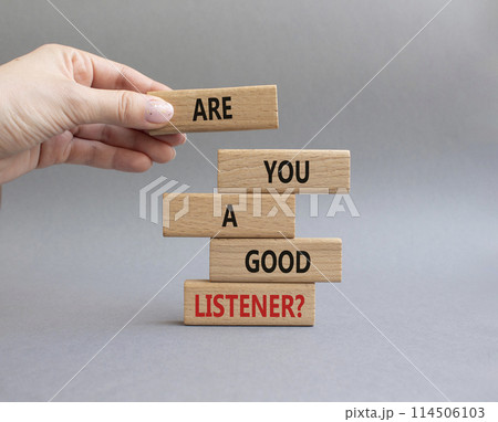 Listening skills symbol. Wooden blocks with words Are you a good Listener. Beautiful grey background. Businessman hand. Business and Are you a good Listener concept. Copy space. Listening skills symbol. Wooden blocks with words Are you a good Listener. Beautiful grey background. Businessman hand. Business and Are you a good Listener concept. Copy space. 114506103