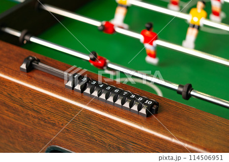 Close Up of a Foosball Table With Foosball Players 114506951