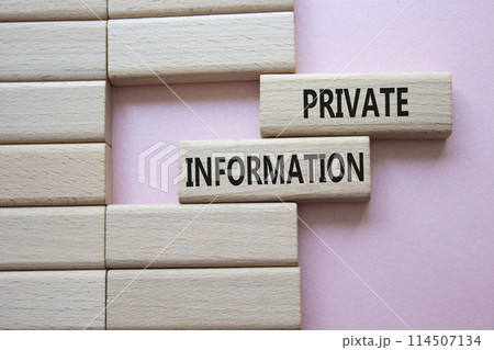 Private Information symbol. Wooden blocks with words Private Information. Beautiful pink background. Business and Private Information concept. Copy space. 114507134