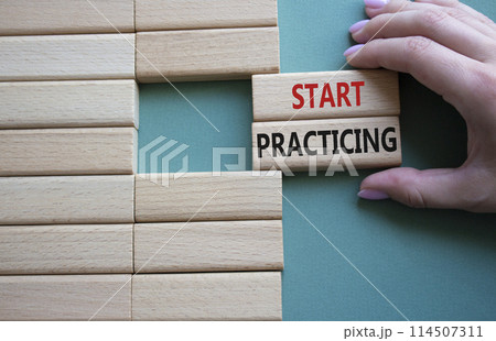Start Practicing symbol. Concept word Start Practicing on wooden blocks. Beautiful grey green background. Businessman hand. Business and Start Practicing concept. Copy space Start Practicing symbol. Concept word Start Practicing on wooden blocks. Beautiful grey green background. Businessman hand. Business and Start Practicing concept. Copy space 114507311