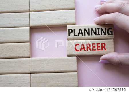 Planning Career symbol. Wooden blocks with words Planning Career. Beautiful pink background. Businessman hand. Business and Planning Career concept. Copy space. Planning Career symbol. Wooden blocks with words Planning Career. Beautiful pink background. Businessman hand. Business and Planning Career concept. Copy space. 114507313
