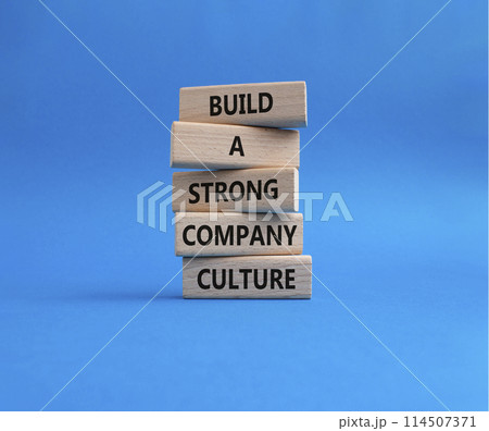 Company culture symbol. Wooden blocks with words Build a strong company culture. Beautiful blue background. Business and Company culture concept. Copy space. Company culture symbol. Wooden blocks with words Build a strong company culture. Beautiful blue background. Business and Company culture concept. Copy space. 114507371
