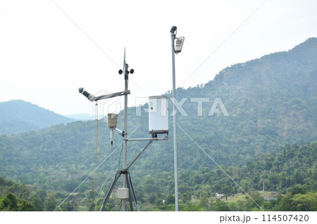 wind speed measurement using vane in mountain background with rain cloud on sky 114507420
