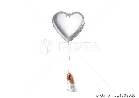 Hand holding blank silver heart balloon mockup, isolated 114508919