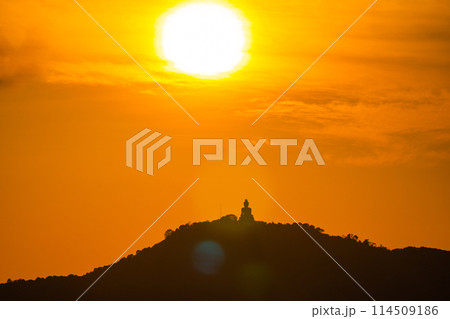 Amazing orange sky behind Phuket big Buddha in sunset. 114509186