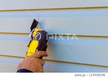 Replacement of exterior plastic siding on wall of house 114509296