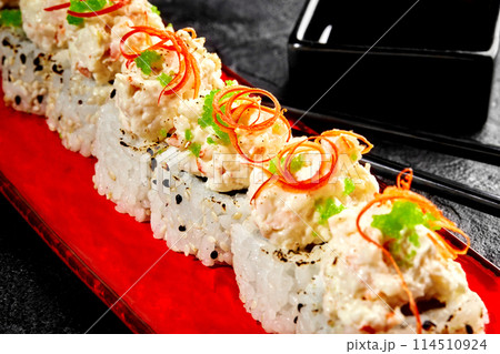 Sushi rolls with cream cheese and shrimp on red plate Sushi rolls with cream cheese and shrimp on red plate 114510924