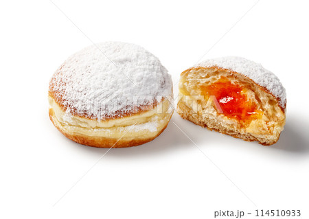 Doughnuts with apricot jelly, sprinkled with powdered sugar 114510933