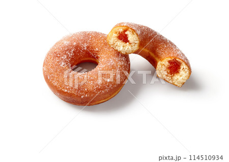Soft fluffy sugar donuts with fruit jelly filling on white Soft fluffy sugar donuts with fruit jelly filling on white 114510934
