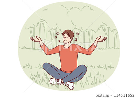 Young guy sits in lotus position on lawn doing yoga and meditating to restore strength Young guy sits in lotus position on lawn doing yoga and meditating to restore strength 114511652