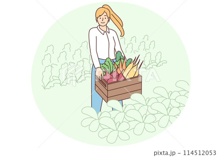 Smiling woman with box of vegetables Smiling woman with box of vegetables 114512053