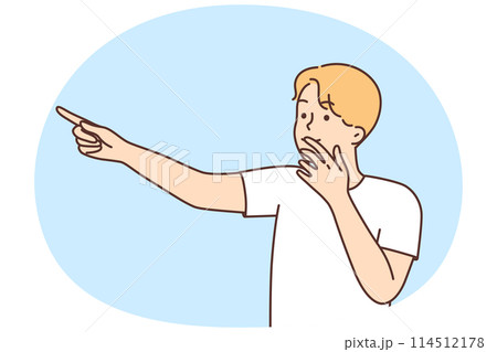 Smiling amazed man point with finger 114512178