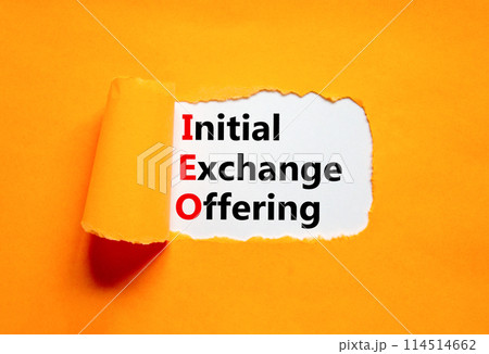 IEO initial exchange offering symbol. Concept words IEO initial exchange offering on beautiful paper. Beautiful orange paper background. Business IEO initial exchange offering concept. Copy space. 114514662