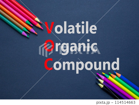 VOC volatile organic compound symbol. Concept words VOC volatile organic compound on paper. Beautiful black background. Colored pencils. Business VOC volatile organic compound concept. Copy space. 114514663