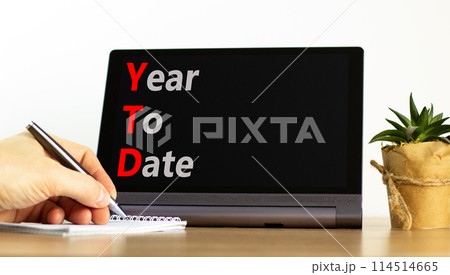 YTD year to date symbol. Concept words YTD year to date on beautiful black tablet. Beautiful white background. Businessman hand. Business YTD year to date concept. Copy space. YTD year to date symbol. Concept words YTD year to date on beautiful black tablet. Beautiful white background. Businessman hand. Business YTD year to date concept. Copy space. 114514665
