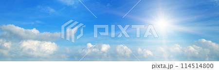 Bright sun on a cloudy sky. Wide photo. 114514800