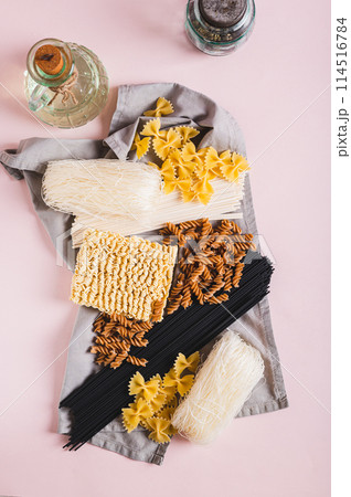 Funchoza, udon, black noodles, buckwheat and wheat pasta on a napkin top and vertical view Funchoza, udon, black noodles, buckwheat and wheat pasta on a napkin top and vertical view 114516784